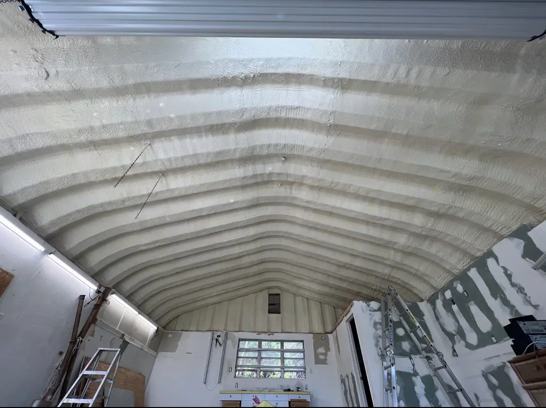 Spray polyurethane foam applied to the underside of a metal roof deck in Cave Creek